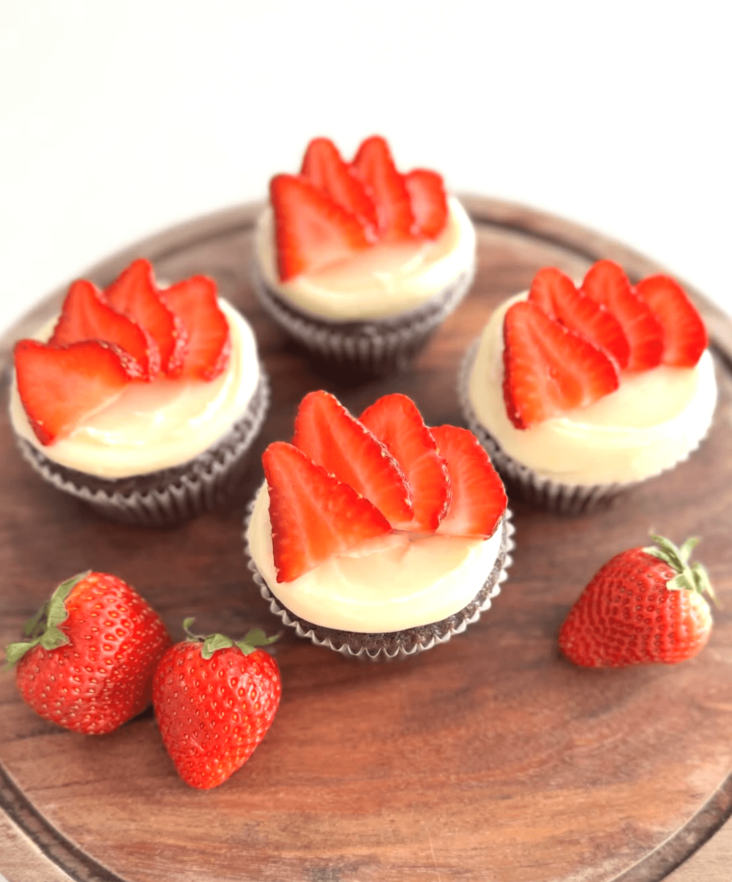 Chocolate cupcakes with vanilla buttercream and fresh strawberry